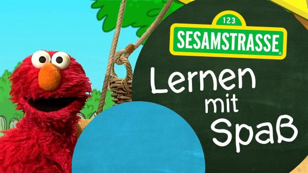 Elmo mit dem Logo "Lernen mit Spaß"